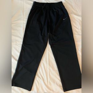 Nike sweatpants with zipper adjust leg openings.